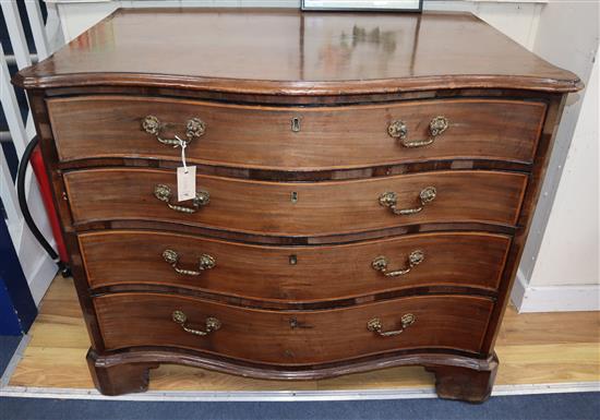 A George III mahogany satinwood cross-banded serpentine fronted chest W.102cm